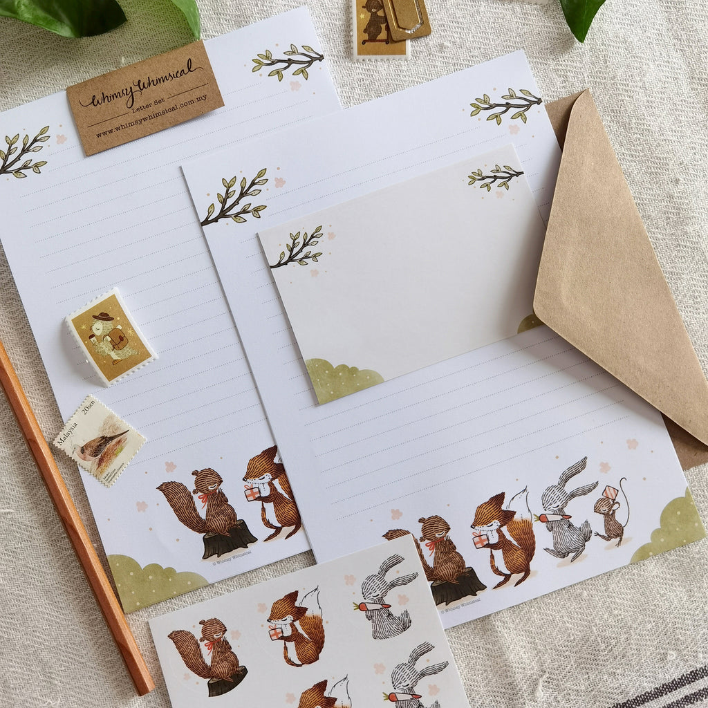 Summer Celebration Delights Letter Writing Set - Heartwarming scenes of woodland animals exchanging gifts, capturing the joy of summer with playful squirrels and cute rabbits.