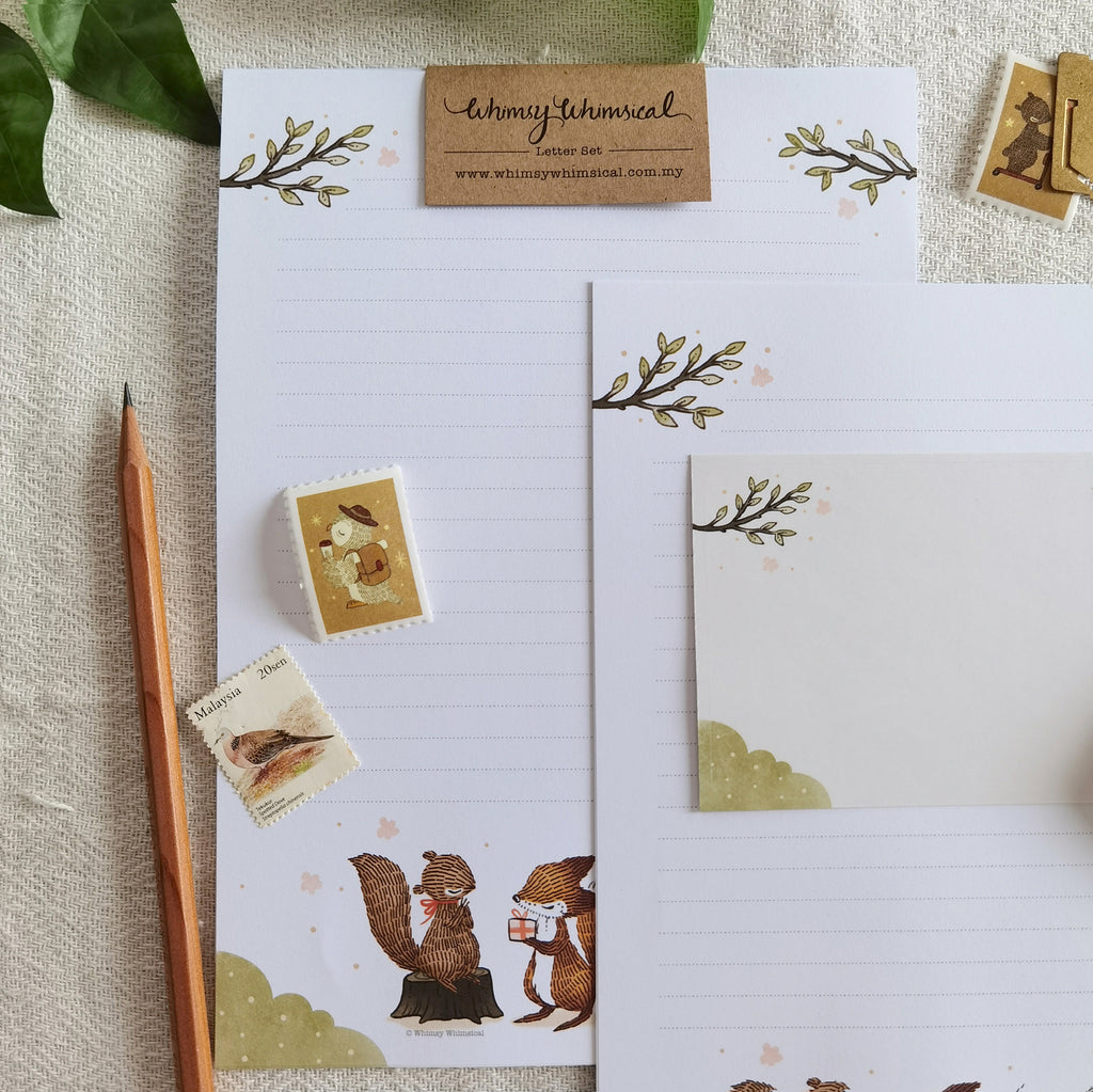 Summer Celebration Delights Letter Writing Set - Heartwarming scenes of woodland animals exchanging gifts, capturing the joy of summer with playful squirrels and cute rabbits.