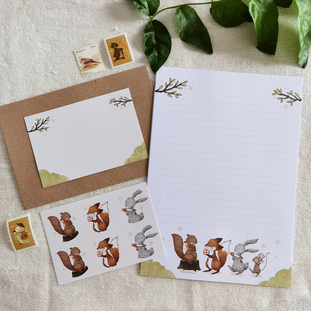 Summer Celebration Delights Letter Writing Set - Heartwarming scenes of woodland animals exchanging gifts, capturing the joy of summer with playful squirrels and cute rabbits.