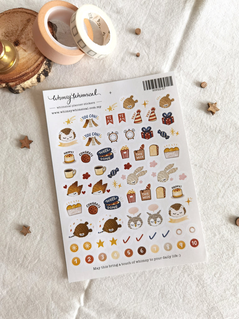 Planner sticker sheet with encouraging woodland animals, scrumptious cookies, presents, and party hat illustrations to decorate your planner.