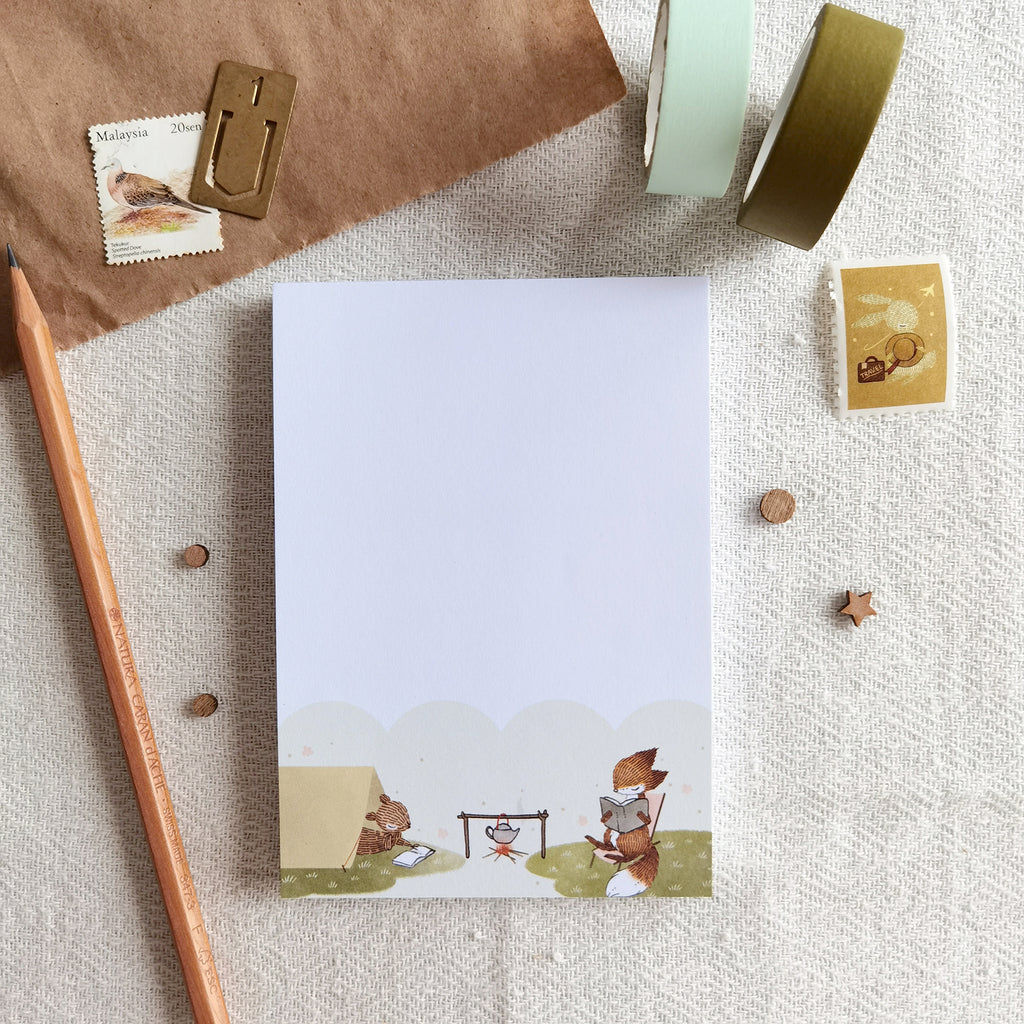 Summer Campfire Memo Pad feature fox and squirrel reading at summer camp bonfire, ideal for jotting notes and creative ideas.