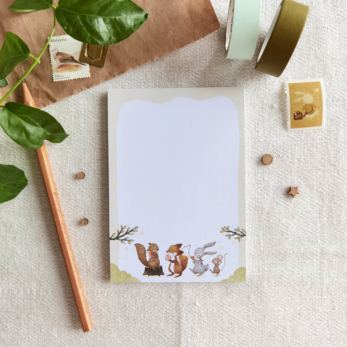 Summer Celebration Delights Memo Pad feature woodland animals exchanging gifts, celebrating summer season, ideal for notes and creativity.