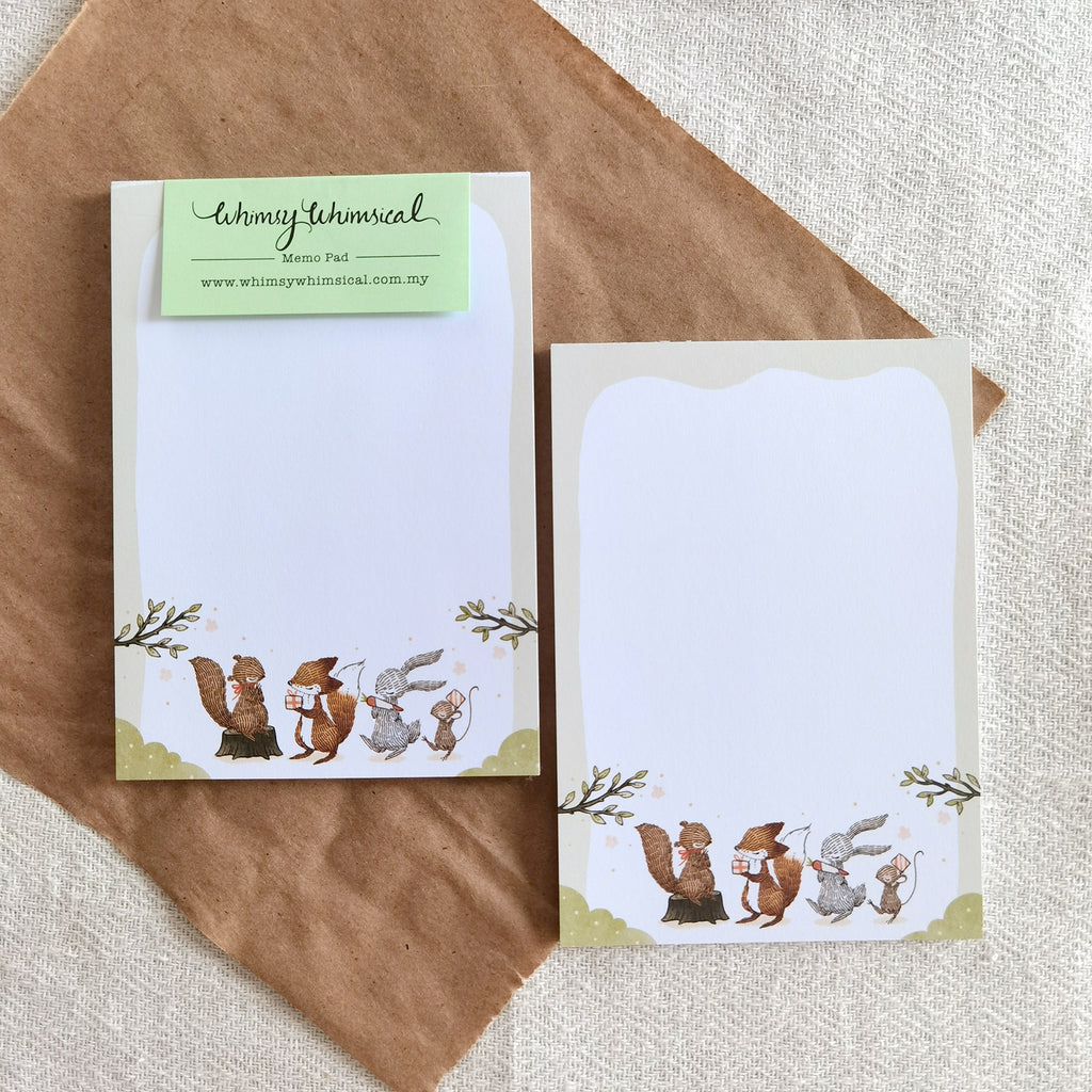 Summer Celebration Delights Memo Pad feature woodland animals exchanging gifts, celebrating summer season, ideal for notes and creativity.