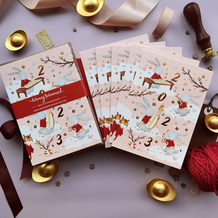 Rabbit Year 2023 CNY Card Set with illustrated rabbits performing Chinese Orchestra music, printed with copper foil stamping. Perfect for festive greetings.