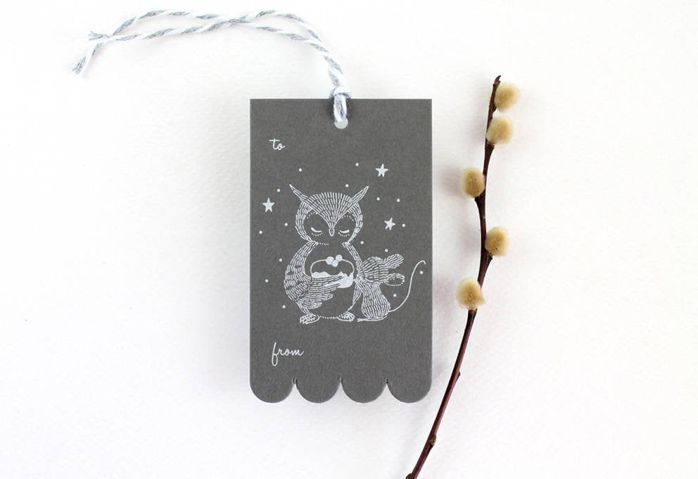 Rectangular gift tag with Owl and Mouse design holding a sweet cake, silver ink on sombre grey cardstock. Scalloped edge on one side. Ideal for birthdays & showers.